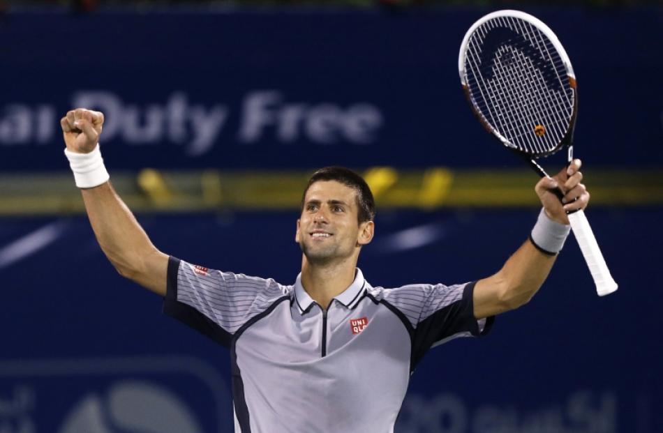 Novak Djokovic of Serbia celebrates after his men's singles final match against Tomas Berdych of...