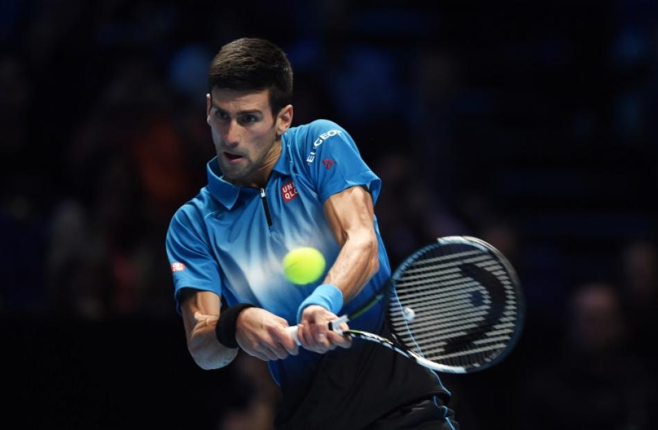 Novak Djokovic returns a shot from Tomas Berdych in their match this morning. Photo: Reuters