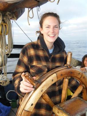 Novice sailor Leigh Harding at the helm of the Alvei sailing ship on her way to Fiji.