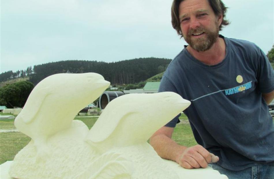 Oamaru Stone Carving Symposium committee chairman Matt King with the winning People's Choice ...