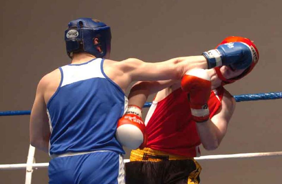 Dema Dyshlav of the Papanui Club, Christchurch, left, fights Keegan Bain, right of Rowes club in...