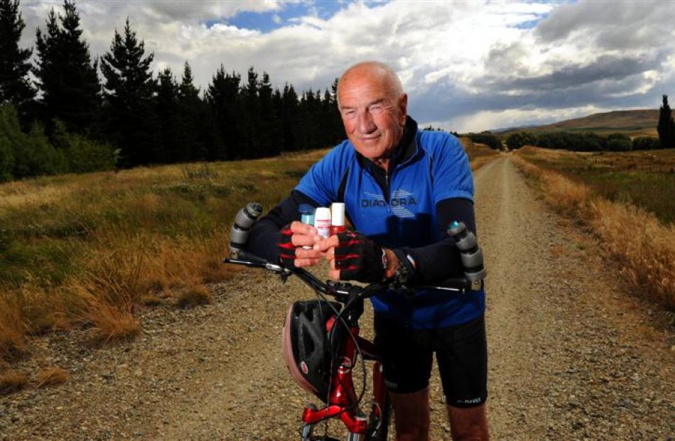 Octogenarian Iain Hickey with the asthma inhalers and nitrolingual spray he carried in his bike...