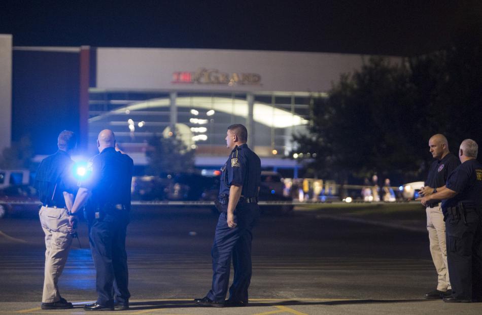Officials secure the scene outside the movie theatre in Lafayette. Photo: Reuters