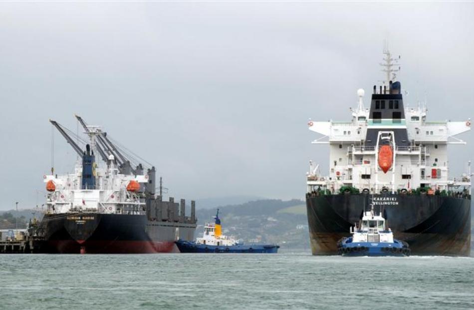 Oil tanker Kakariki (right) passes carrier  Glorious Sunrise,  which was berthed at the...