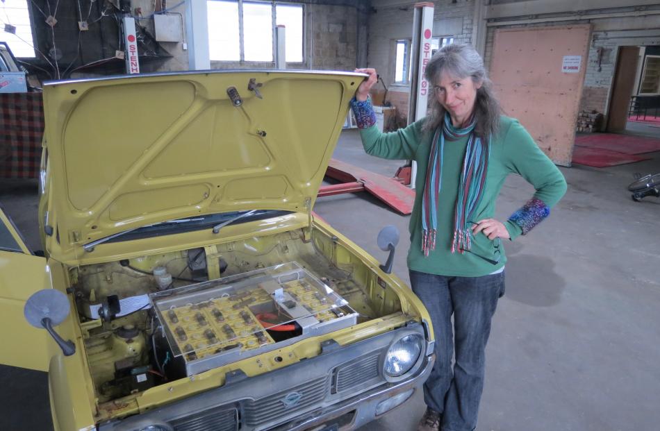 OilFree Otago spokeswoman Rosemary Penwarden displays a vehicle that has been fully converted  to...