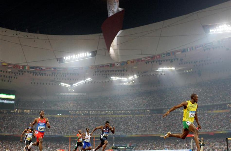 Jamaica's Usain Bolt crosses the finish line to win the gold in the men's 200-metre final. (AP...