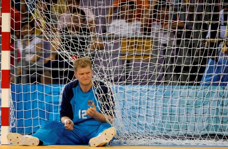 Germany's goalkeeper Johannes Bitter reacts after Iceland scored during their men's handball...
