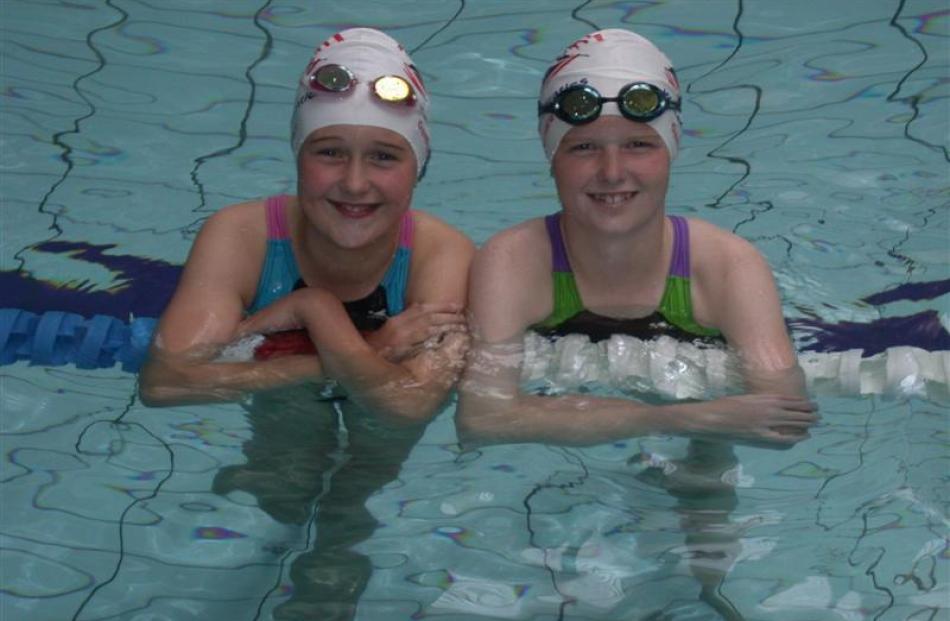 Omarama swimmers Alana (left) and Danni Walsh spend eight hours a week just travelling to Oamaru...