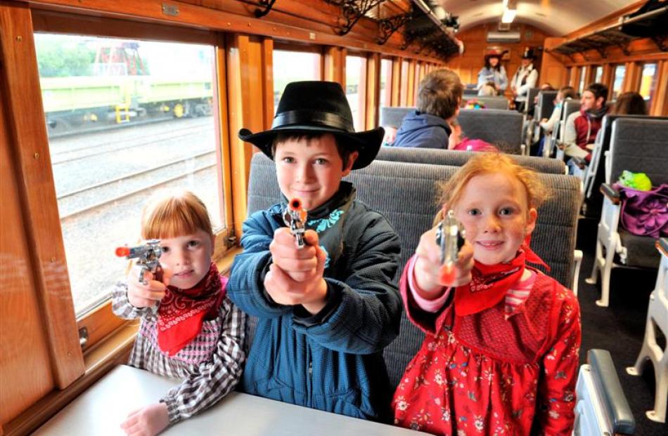 On board the train before departure are (from left) Anna Telfer Chiles (5), Josh Telfer Chiles (8...
