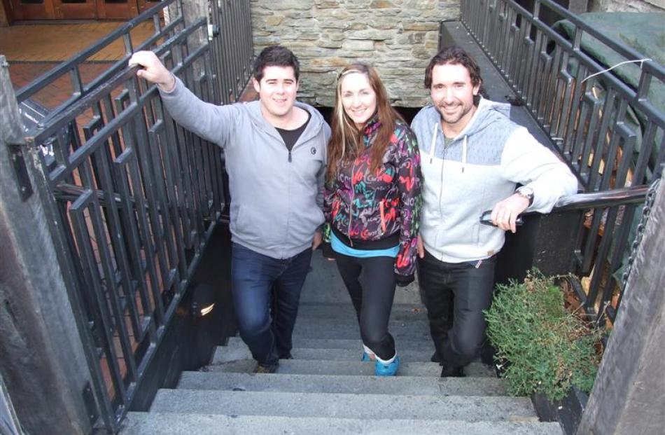 On the steps leading down to new live music venue Vinyl Underground are co-director Ben Calder ...
