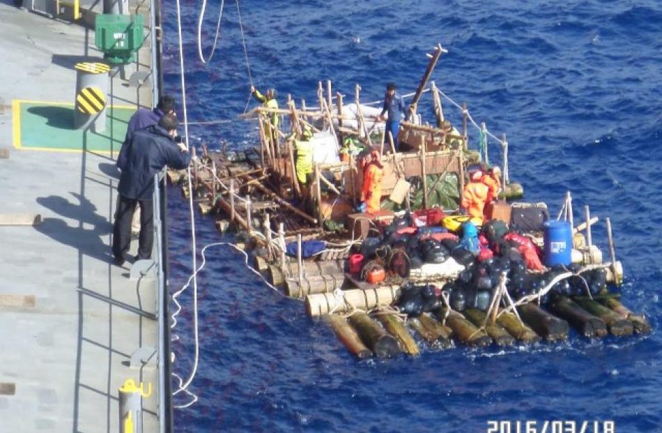 One of the Kon-Tiki rafts is lifted to safety by the Chilean Navy. REUTERS/Chilean Navy