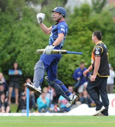 Otago all-rounder Ian Butler leaps into the air after hitting the winning runs.