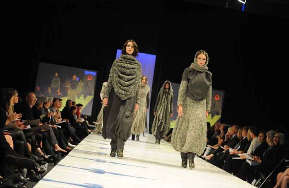 Ali McD models Sarah Johnston and Eva Duncan parade Igor Galas' knitted works at the Emerging...