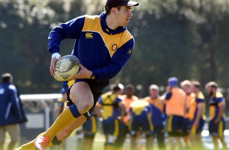 Otago first five-eighth Fletcher Smith moves the ball at Otago training at Logan Park this week....