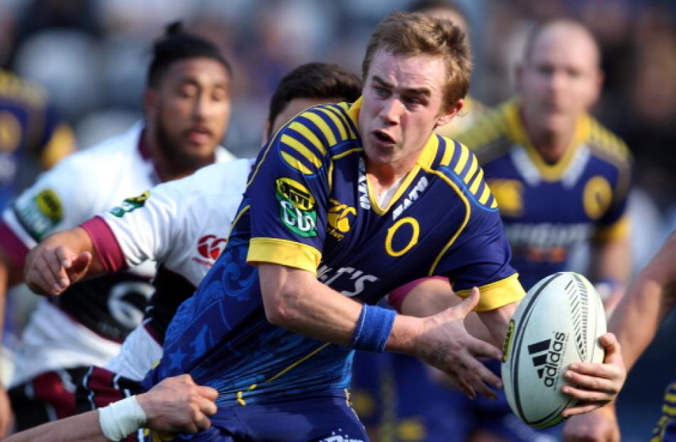 Otago first five Hayden Parker looks to bust through the North Harbour defence. (Photo by Rob...