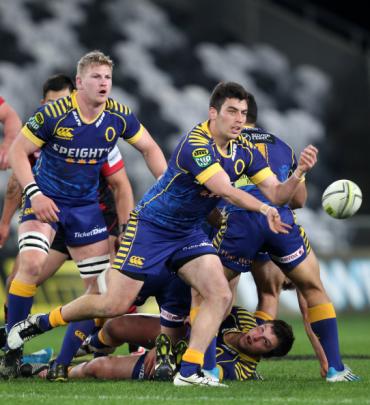 Otago halfback Nick Ealey gets a pass away during his team's match against Canterbury. (Photo by...