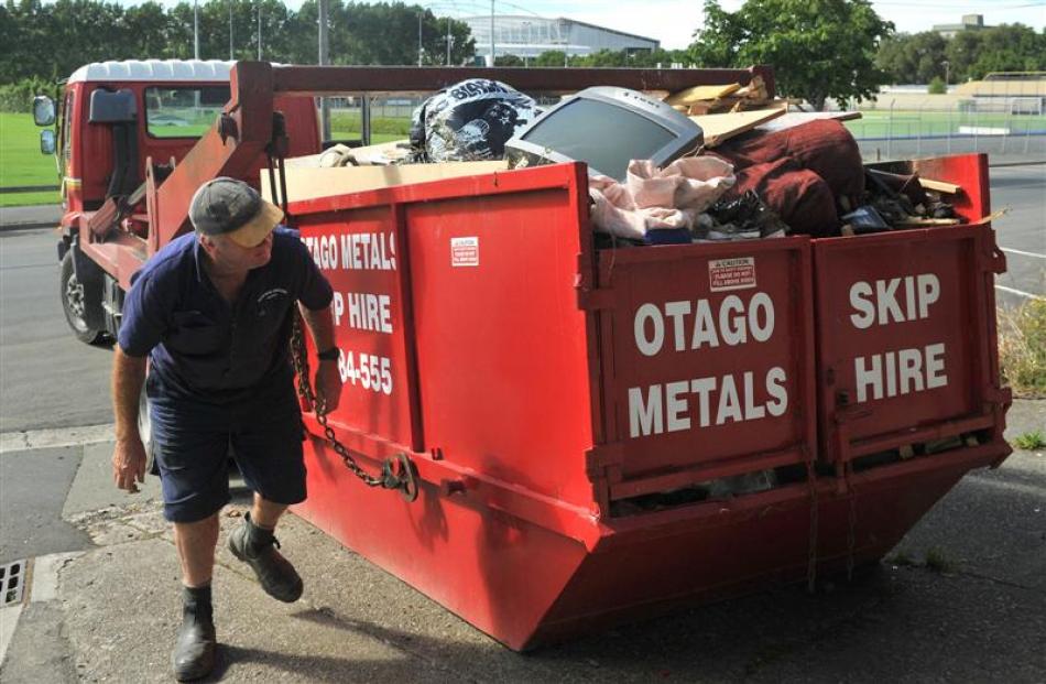 Otago Metals Skip Hire worker Allan Johnston, pictured hooking up a skip on Harbour Tce, 
...