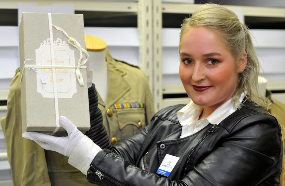 Otago Museum collection officer Jamie Metzger with a Christian Dior shoebox. Photos by Gregor...