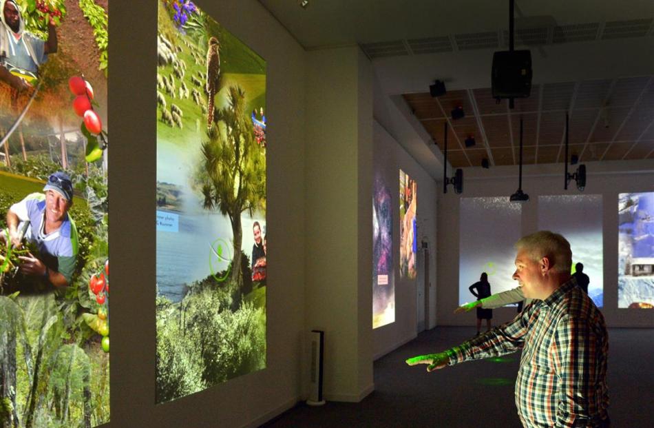 Otago Museum director Dr Ian Griffin uses the ‘‘laser gesture control system’’ in the museum’s...