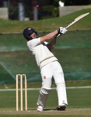 Otago opener Ryan Duffy swings at a bouncer during his first innings knock of 90 not out on day...