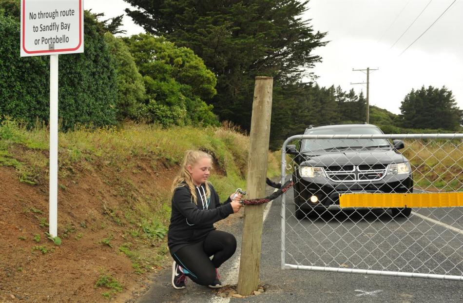 Otago Peninsula resident Sophie Potter (11) is fed up with having to open a gate blocking access...