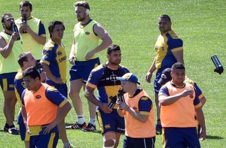 Otago players get some water on  a hot day for training at Logan Park yesterday. Photo by Peter...