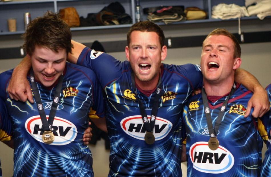 Otago players (L-R) Jacob Duffy, Ian Butler and Nick Beard celebrate after winning the HRV T20...