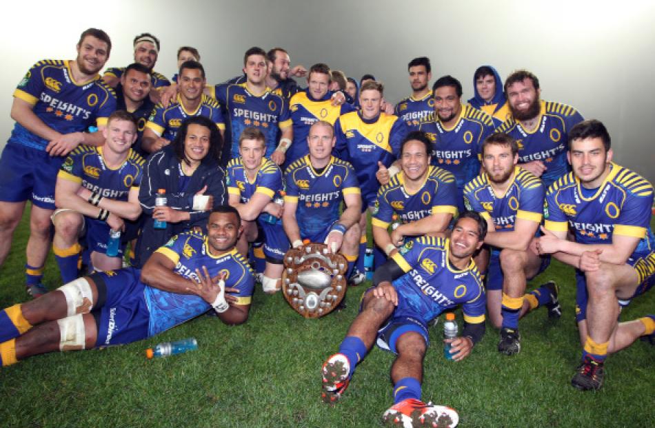 Otago players pose for a photo with the Donald Stuart Memorial Trophy after beating Southland in...