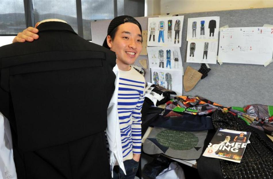 Otago Polytechnic fashion student Marc Jun works on his menswear collection, which he hopes to...