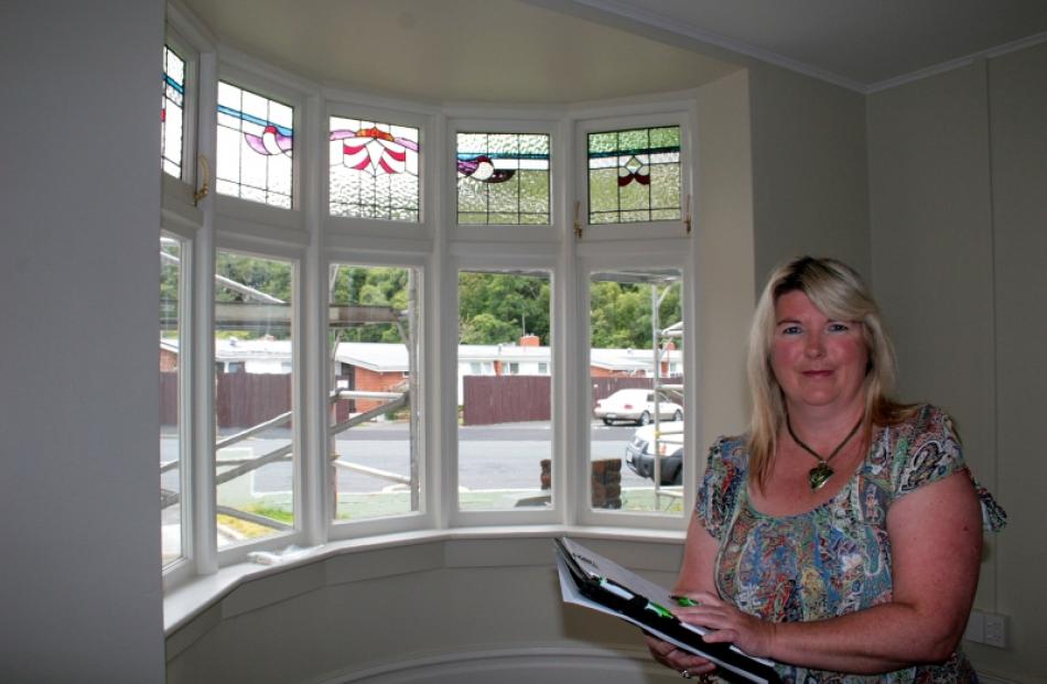 Otago Property Management managing director Sonia Thom checks on progress at a fully renovated...