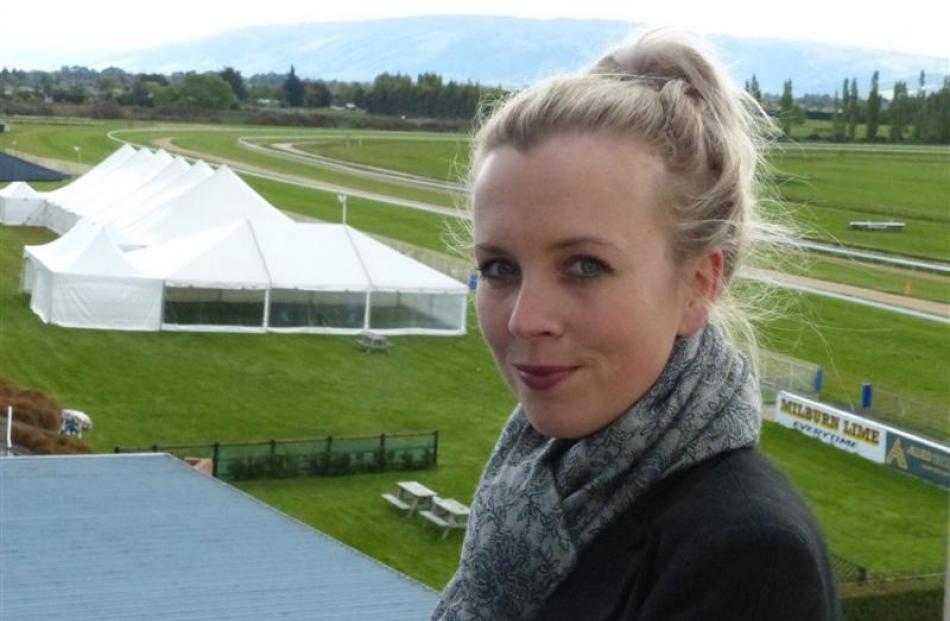 Otago Racing Club events and marketing manager Charlotte Neilson above the marquees being set up...