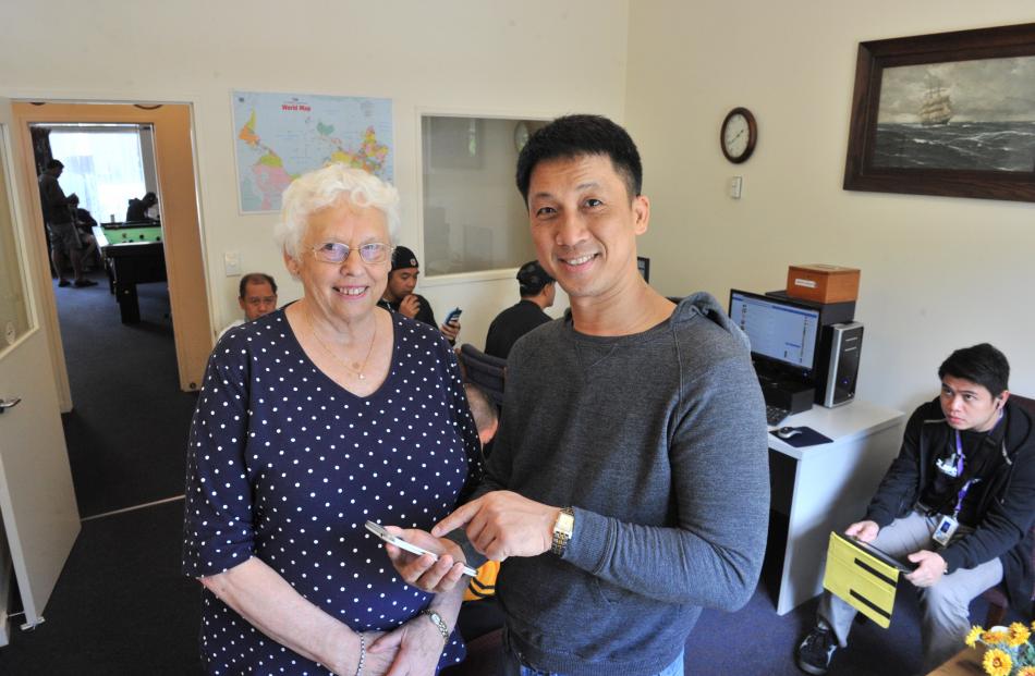 Otago Seafarers Centre manager Shirley Farquhar, QSM, (80) with cruise-ship waiter Eduardo Gan ...