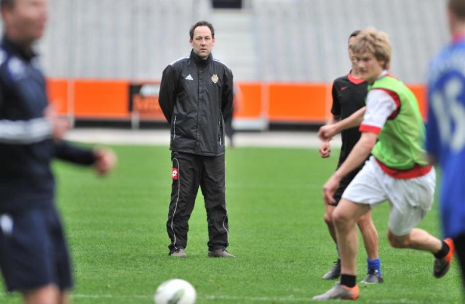 Otago United coach Richard Murray leads his team in training at Forsyth Barr Stadium. Photo by...