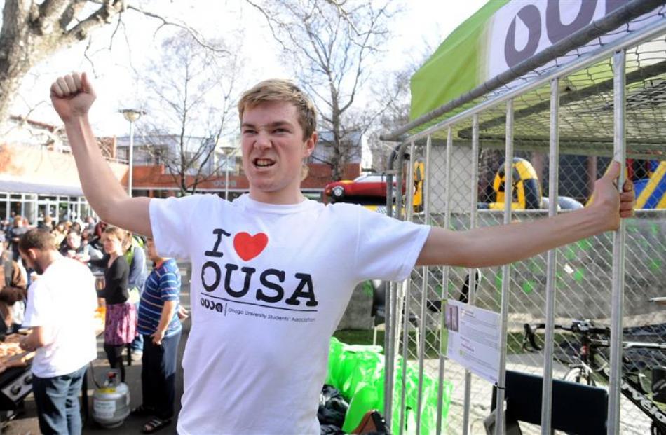 Otago University Students' Association president Logan Edgar leaves a cage on the University...
