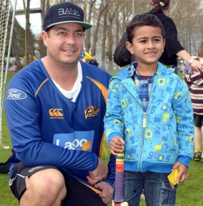 Otago Volts batsman Jesse Ryder poses for a photograph with Aron Sam Blesson (5), of Tainui...
