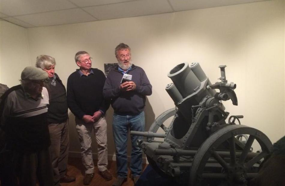 Owaka Museum committee member John Burgess (left) looks on as Bill Lang, from the Otago branch of...