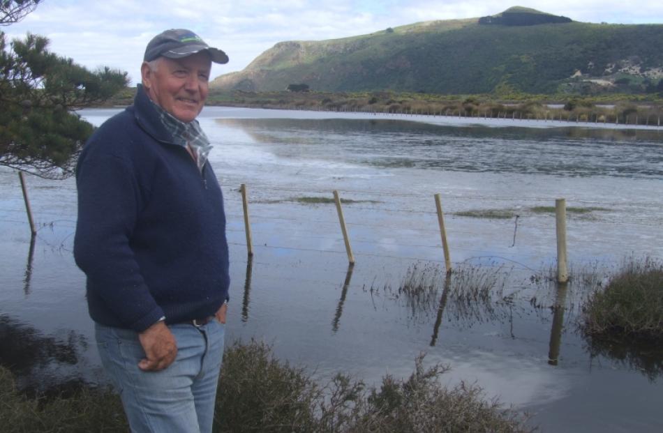 Part of Hoopers Inlet resident Sam Neill's property has been flooded because of the inlet...