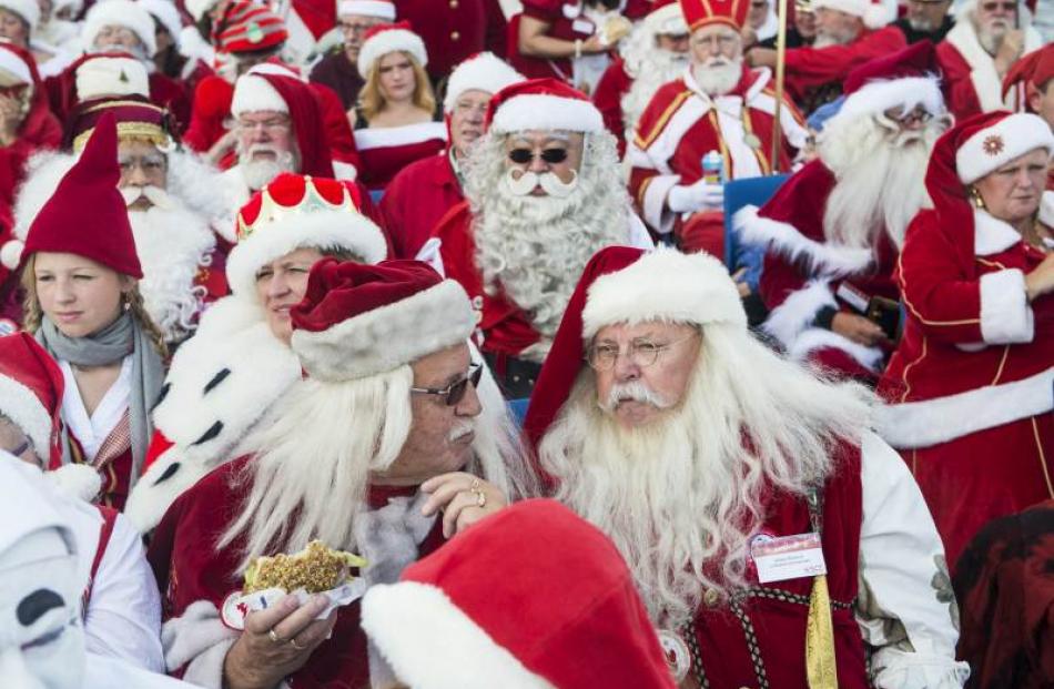 Participants take a boat tour during the World Congress of Santas in Copenhagen, Denmark. Photo...