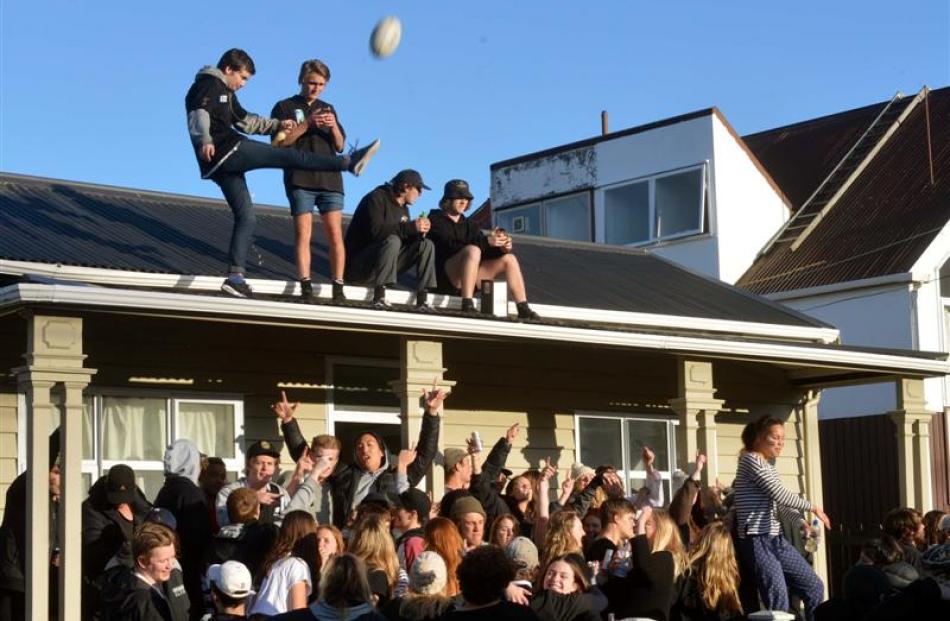 Partygoers  in Castle St celebrate the All Blacks' Rugby World Cup win yesterday morning.