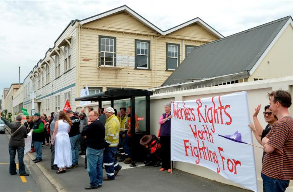 Past and present Hillside workers and supporters gather outside the workshops' main gates...