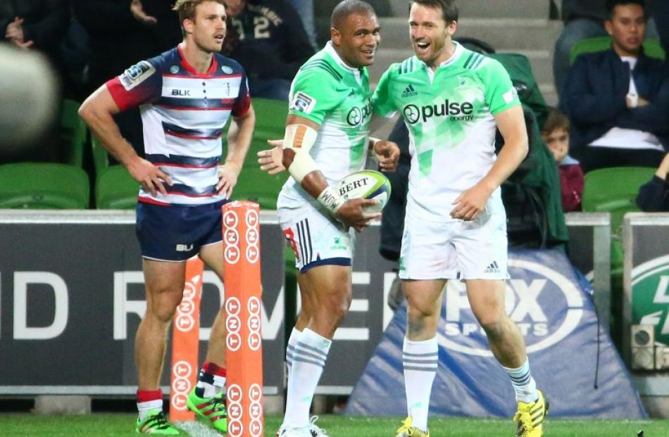 Patrick Osborne and Ben Smith celebrate after Osborne scored for the Highlanders in their win...