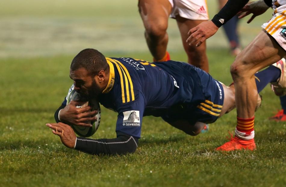Patrick Osborne of the Highlanders dives over to score a try during the round 16 Super Rugby...