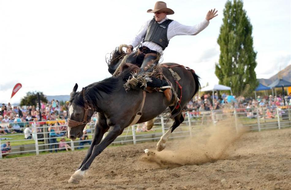 Paul Robinson, of Palmerston, contests the saddle bronc competition. Photo by Stephen Jaquiery.