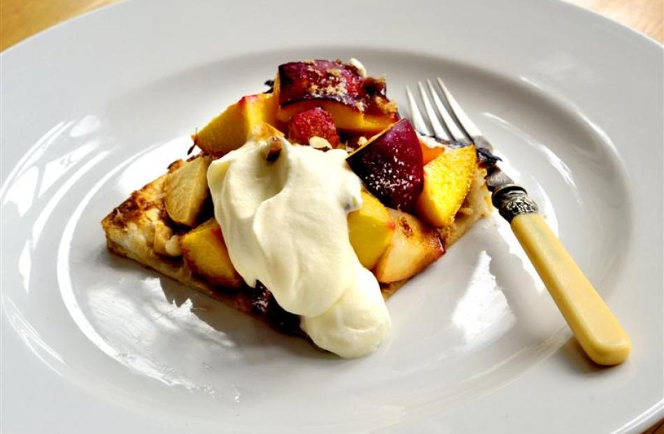 Peach tart with toasted hazelnuts and cream Photo by Gregor Richardson.