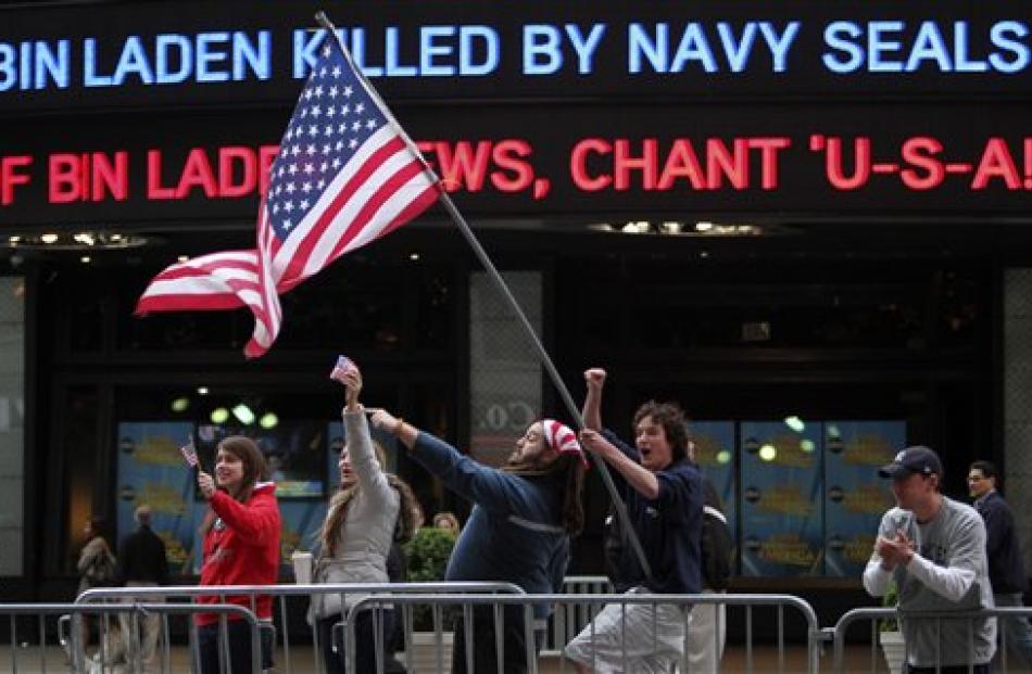 People celebrate outside the ABC studio in New York's Times Square as news of Osama bin Laden's...