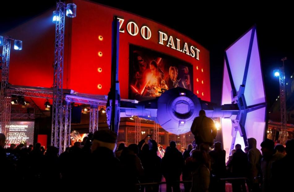 People wait in front of the Zoo Palast cinema before the German premiere in Berlin. Photos Reuters