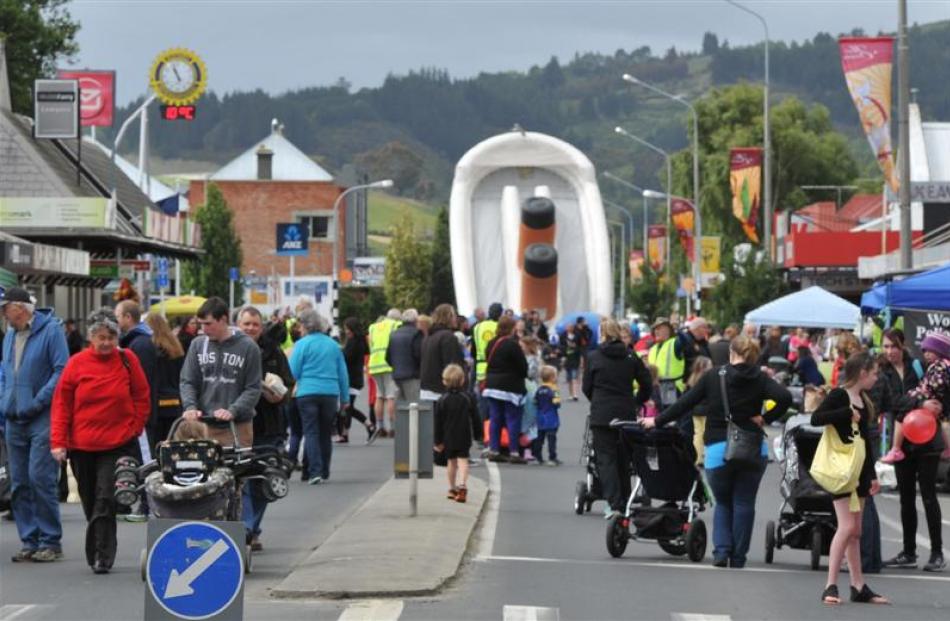People walk on a closed-off Gordon Rd during the annual Mosgiel market day on Saturday. Photo by...