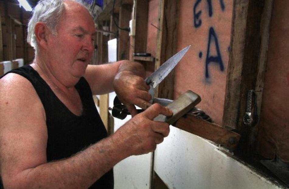 Peter Casserly sharpens his shears.