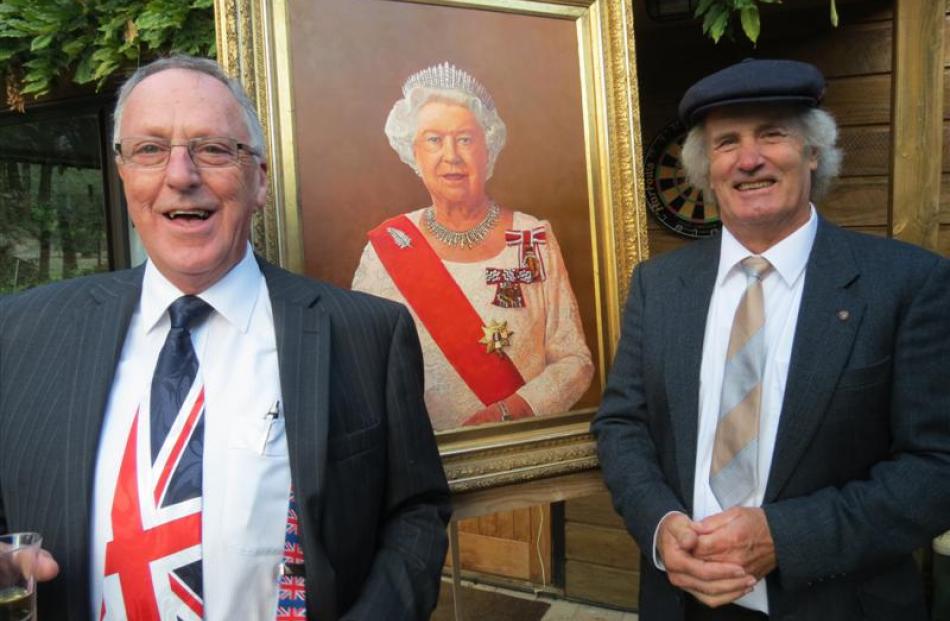 Peter Doyle (left) and Thomas Brown with a portrait of the Queen, painted by  Brown in honour of...