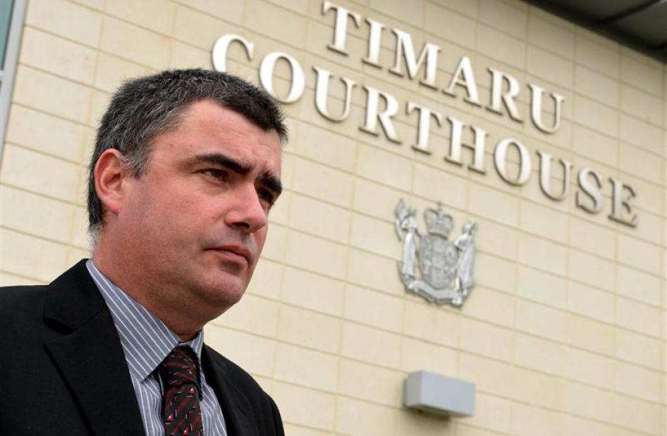 Peter Lewis, the father of teenager William Lewis, stands outside the High Court in Timaru...